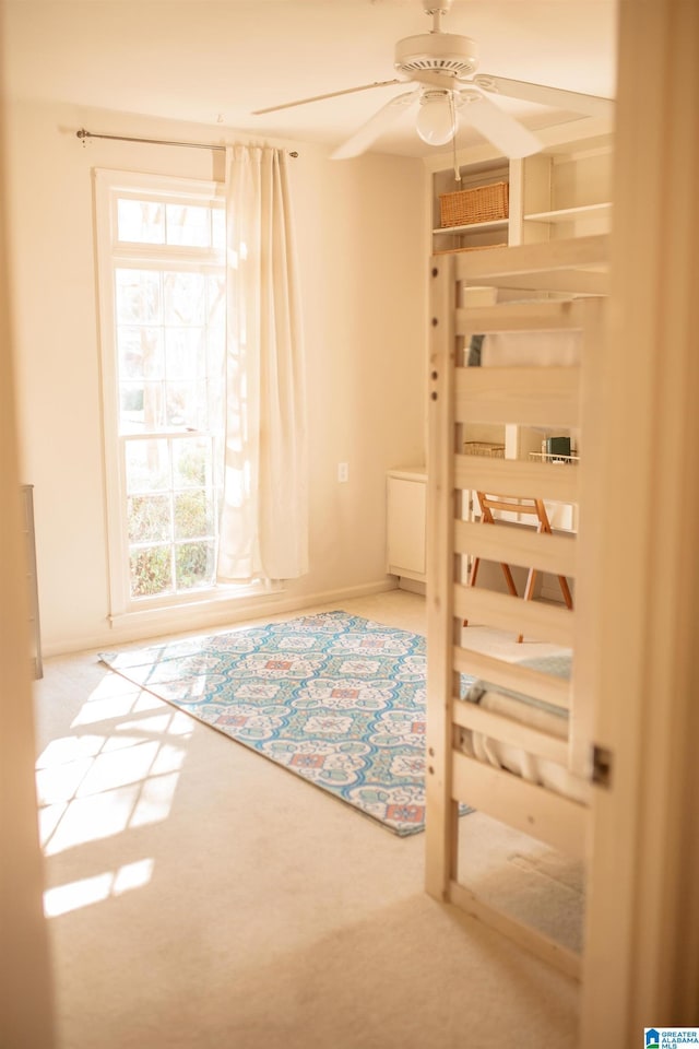 carpeted bedroom featuring ceiling fan