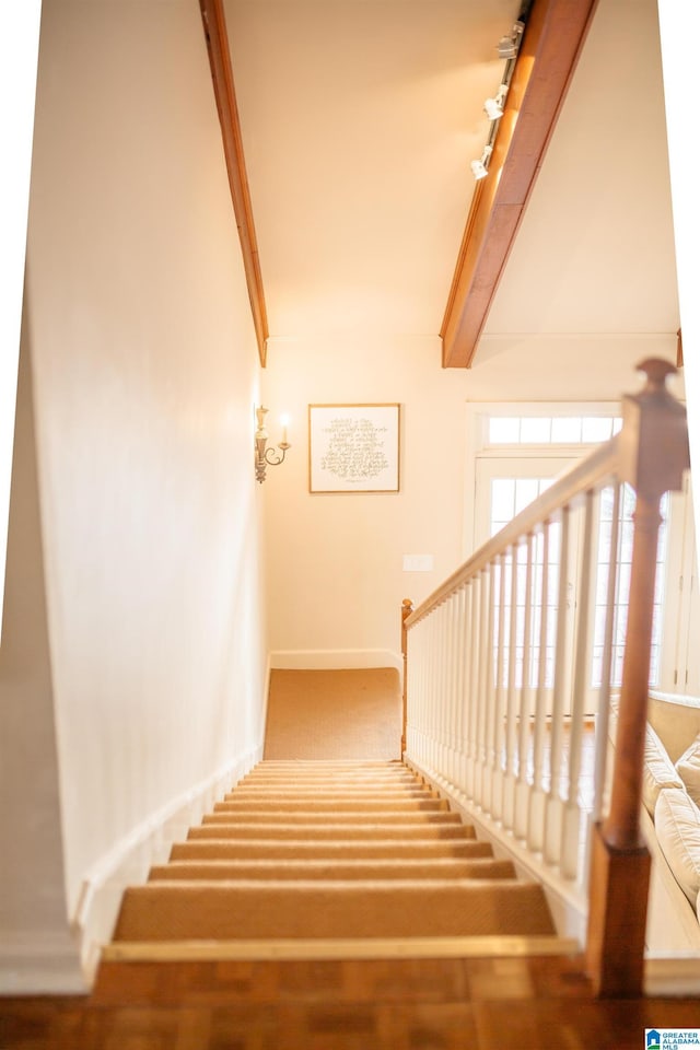 stairway with beam ceiling