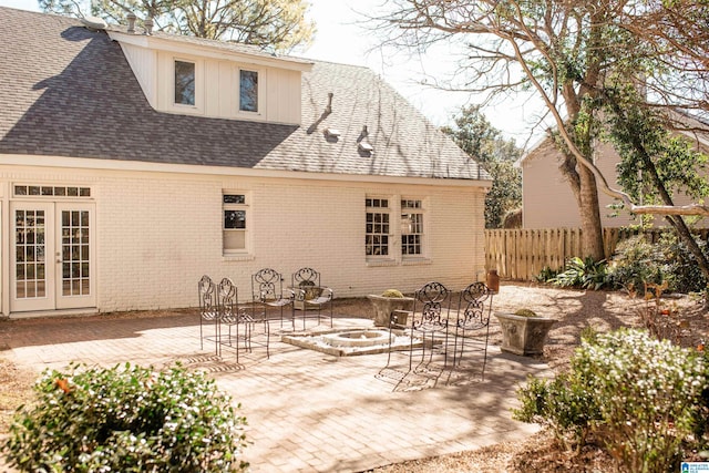 rear view of property featuring a patio area and french doors