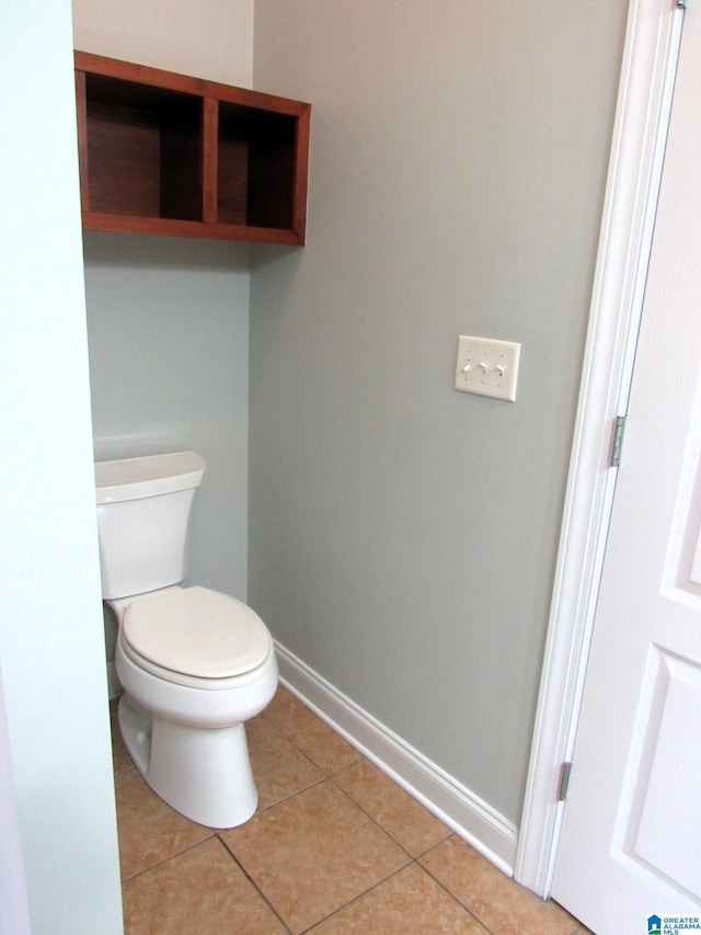 bathroom featuring tile patterned flooring and toilet