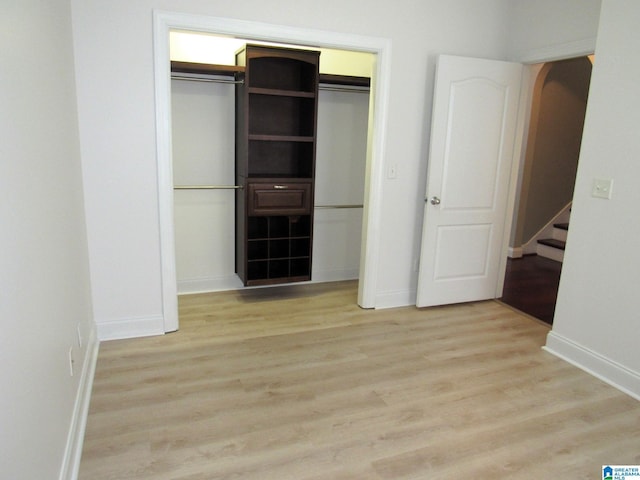 unfurnished bedroom featuring light wood-type flooring