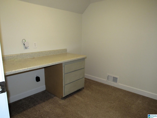 laundry room with dark colored carpet