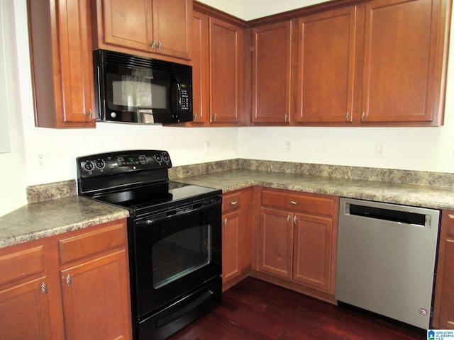 kitchen with dark hardwood / wood-style flooring and black appliances