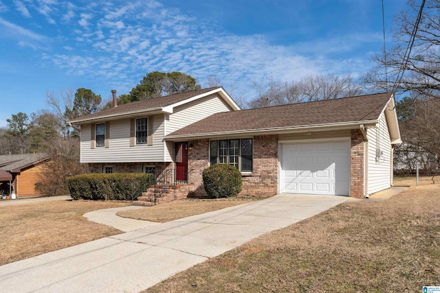 tri-level home featuring a garage and a front yard