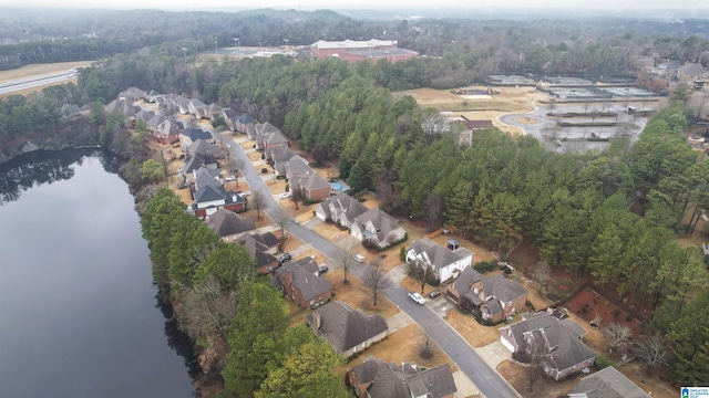 birds eye view of property featuring a water view and a residential view