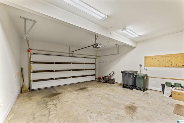 garage featuring baseboards and a garage door opener