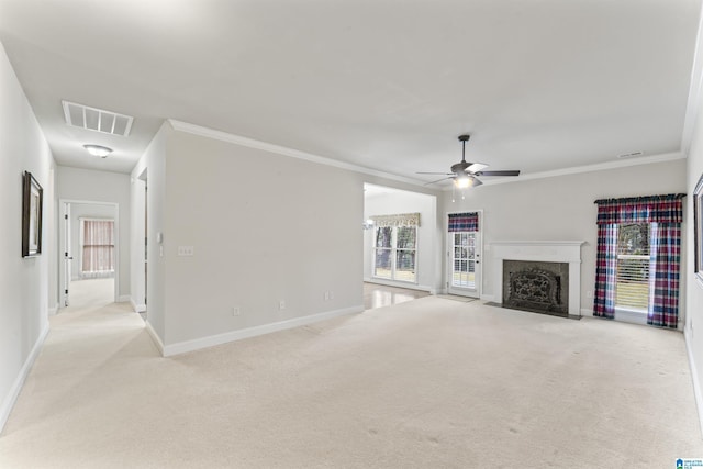 unfurnished living room featuring light carpet, ceiling fan, visible vents, and a high end fireplace