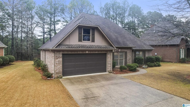 view of front of house with a shingled roof, concrete driveway, brick siding, and a front lawn