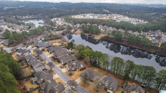 drone / aerial view featuring a water view and a residential view