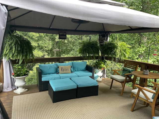 deck featuring a gazebo and outdoor lounge area