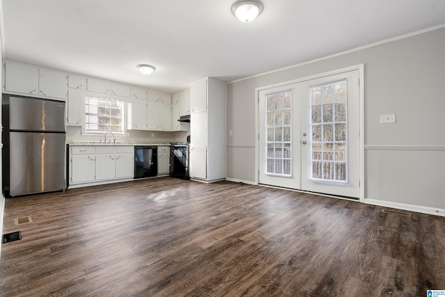 kitchen featuring sink, stainless steel refrigerator, dishwasher, range, and french doors