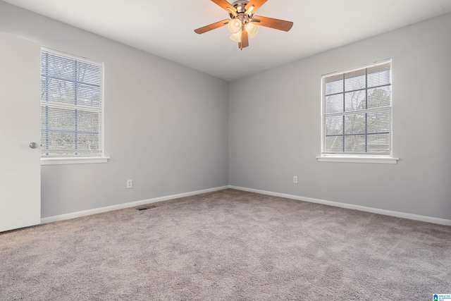 unfurnished room with carpet floors and ceiling fan