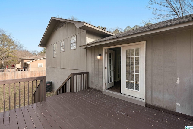 wooden deck featuring cooling unit