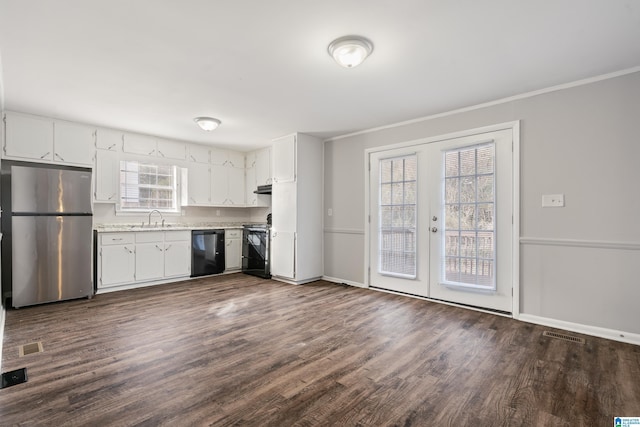 kitchen with sink, stainless steel appliances, dark hardwood / wood-style floors, and white cabinets