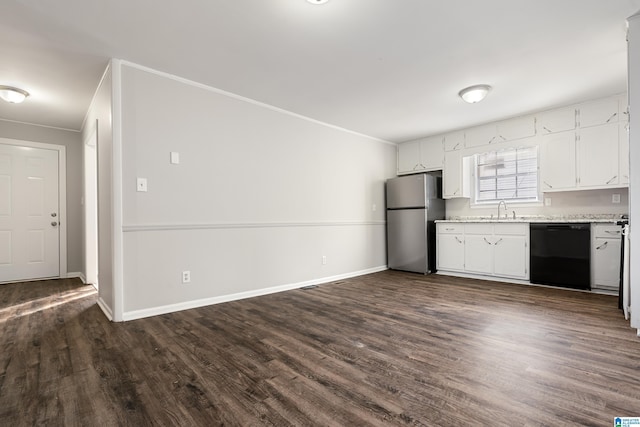 kitchen featuring sink, stainless steel refrigerator, black dishwasher, white cabinets, and dark hardwood / wood-style flooring