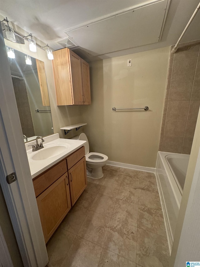 bathroom featuring vanity, tile patterned floors, and toilet