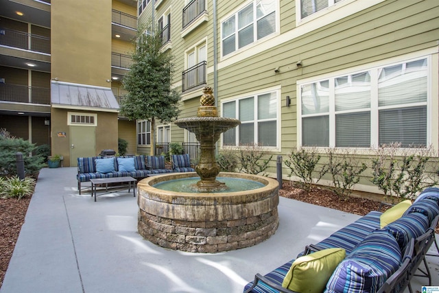 view of home's community with outdoor lounge area and a patio