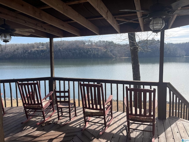 deck featuring a water view and ceiling fan