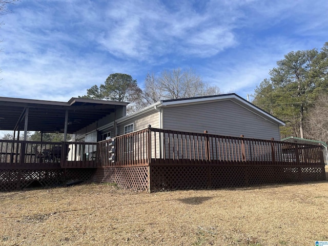 back of property featuring a deck