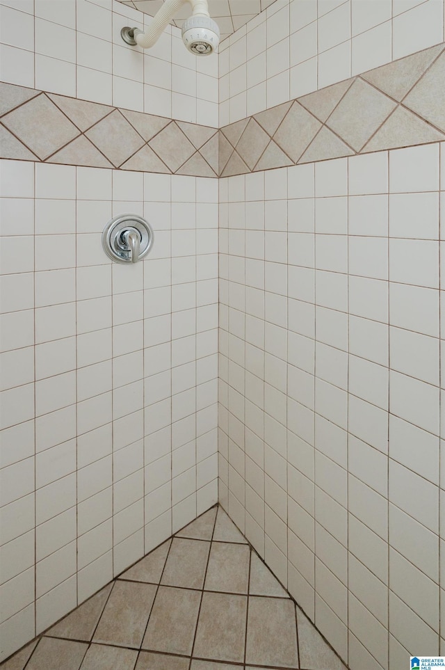 bathroom with a tile shower