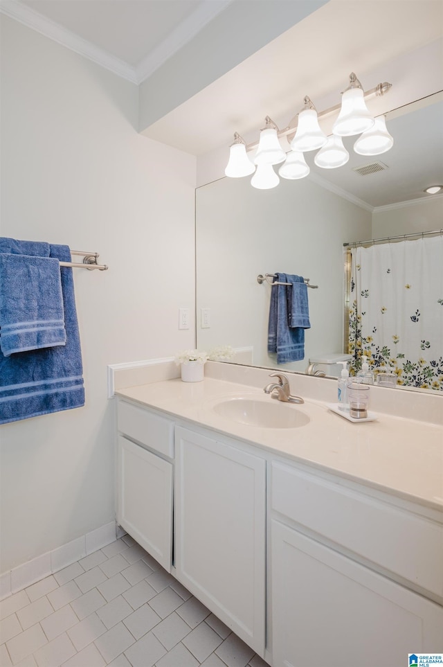 bathroom with ornamental molding and vanity