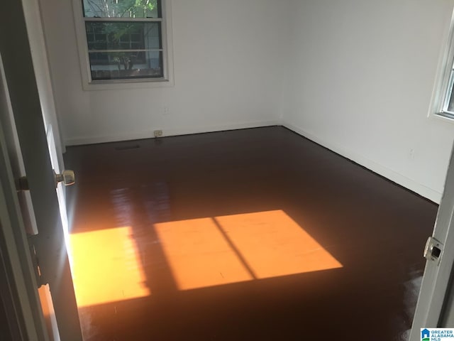 unfurnished room featuring hardwood / wood-style flooring