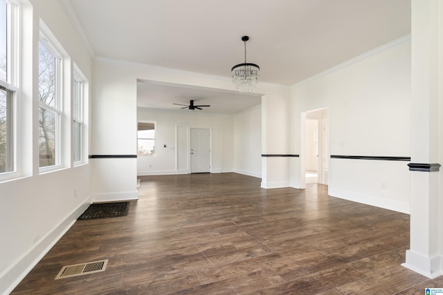 interior space with ceiling fan with notable chandelier, dark wood-type flooring, and ornamental molding