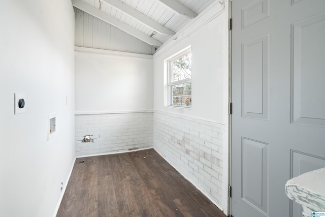 unfurnished room featuring brick wall, vaulted ceiling with beams, wooden ceiling, and dark hardwood / wood-style flooring