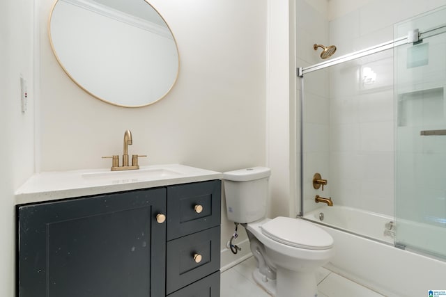 full bathroom with tile patterned flooring, vanity, shower / bath combination with glass door, and toilet