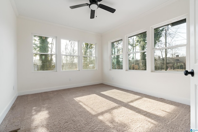 unfurnished sunroom with ceiling fan and a healthy amount of sunlight