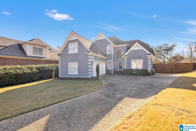 view of front facade with a garage and a front yard