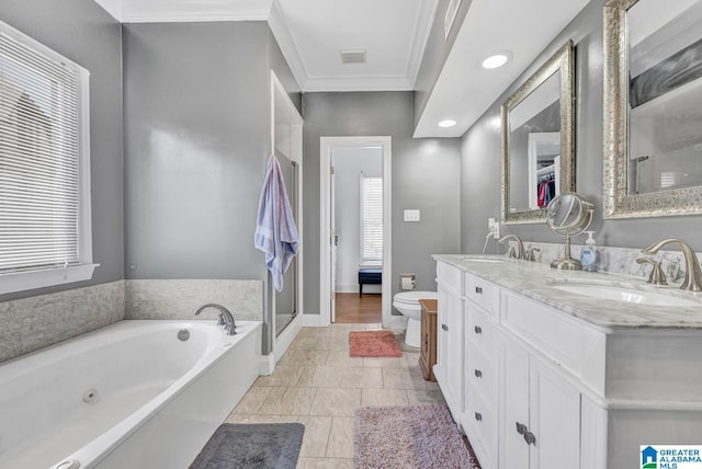 full bathroom featuring vanity, ornamental molding, shower with separate bathtub, and toilet