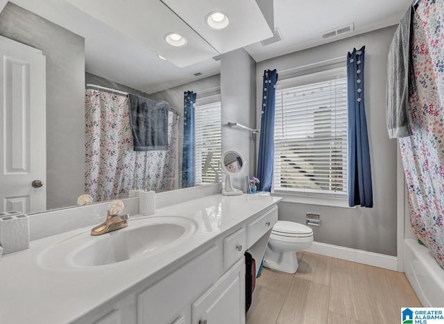 full bathroom with vanity, toilet, and shower / bathtub combination with curtain