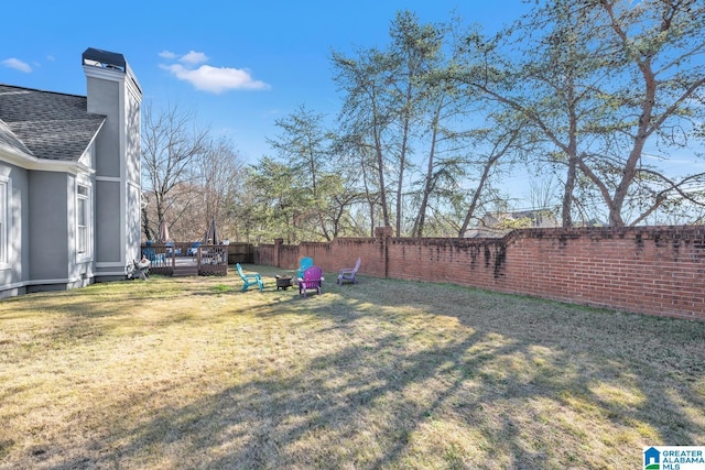 view of yard featuring a wooden deck