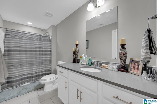 bathroom with vanity, a shower with shower curtain, tile patterned floors, and toilet