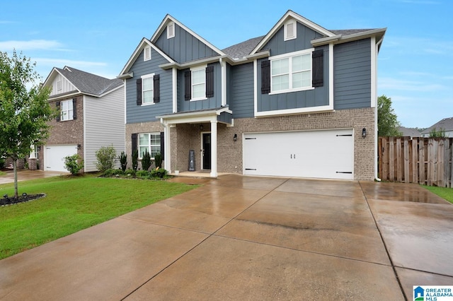 craftsman inspired home featuring a garage and a front yard