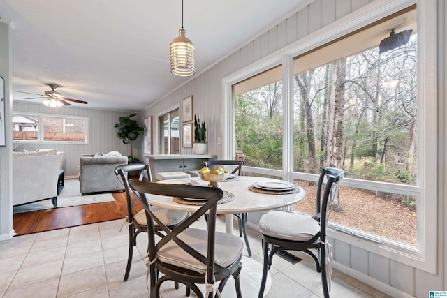 dining space featuring ceiling fan and light tile patterned floors