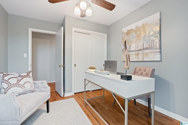 office space featuring hardwood / wood-style flooring and ceiling fan