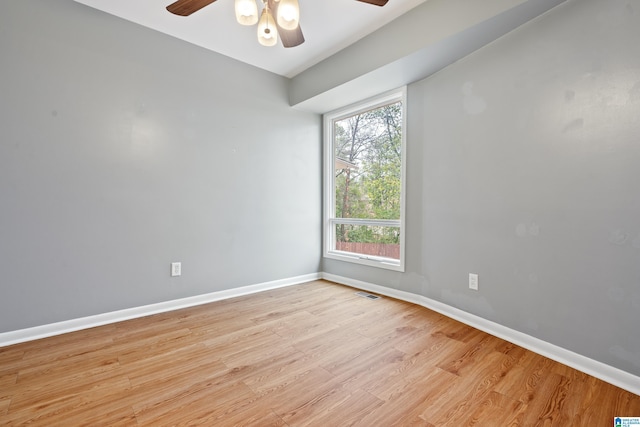 spare room featuring ceiling fan and light hardwood / wood-style flooring