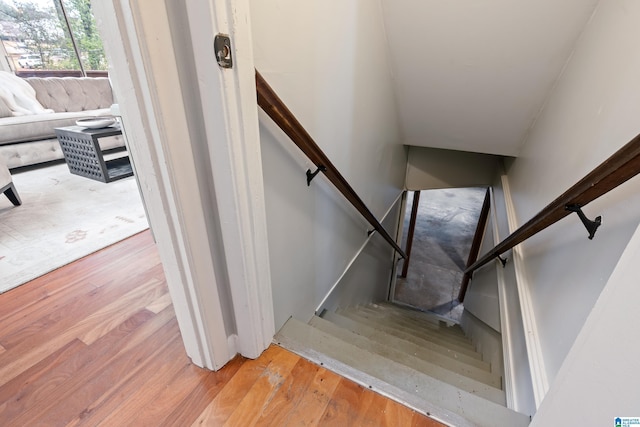 staircase featuring hardwood / wood-style floors