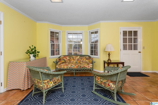 sitting room featuring tile patterned flooring, crown molding, and a textured ceiling