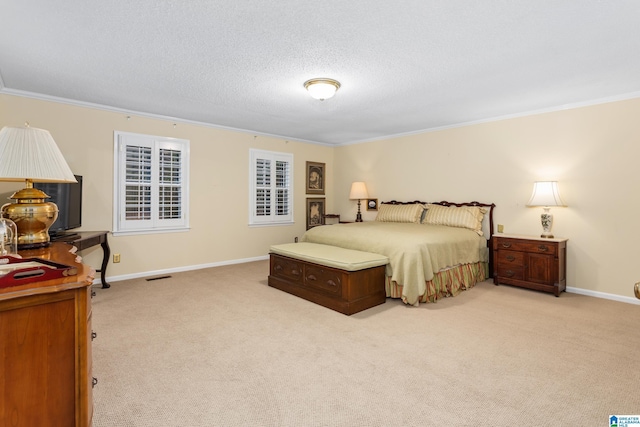 bedroom featuring crown molding, light carpet, and a textured ceiling