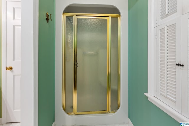 bathroom with an enclosed shower