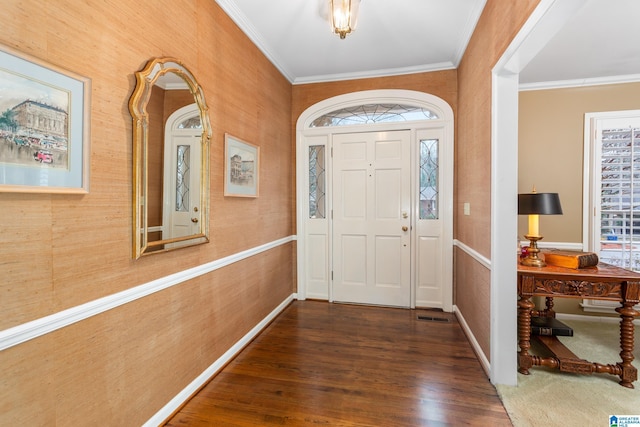 entrance foyer with dark hardwood / wood-style flooring and ornamental molding