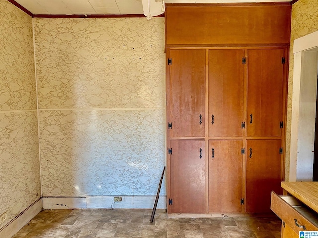 interior space with crown molding