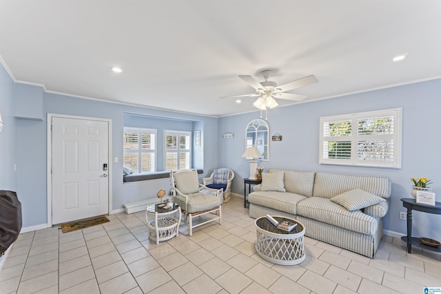 living room featuring crown molding, ceiling fan, plenty of natural light, and light tile patterned flooring