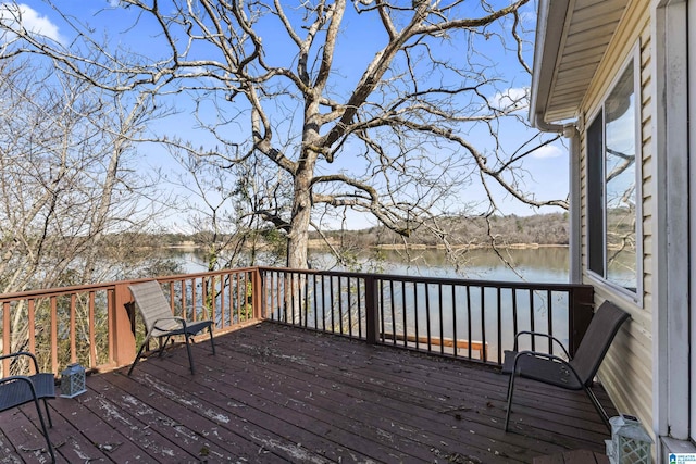 wooden deck with a water view