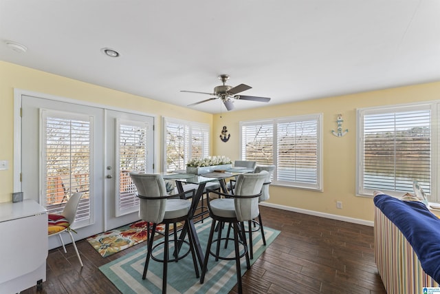 dining room featuring dark hardwood / wood-style flooring, french doors, and ceiling fan