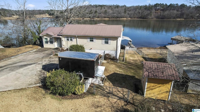 view of property exterior featuring a water view