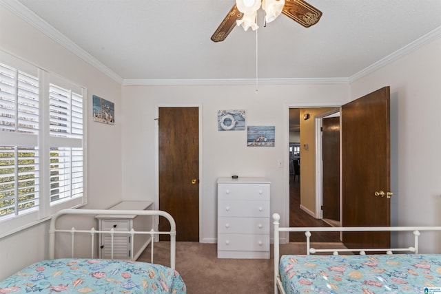 carpeted bedroom with crown molding and ceiling fan